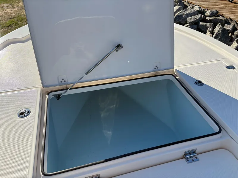 Slide: The Image of 2024 Sea Born FX FX24 boat storage compartment open, showcasing spacious interior. - 18