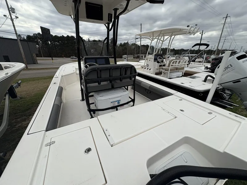 Slide: The Image of 2024 Sea Born FX FX24 boat interior with seating and storage compartments. - 5