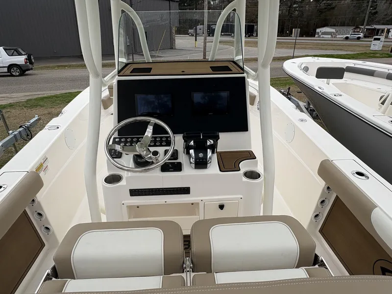 Slide: The Image of 2025 Sea Born LX LX24 boat console with dual screens and steering wheel. - 13