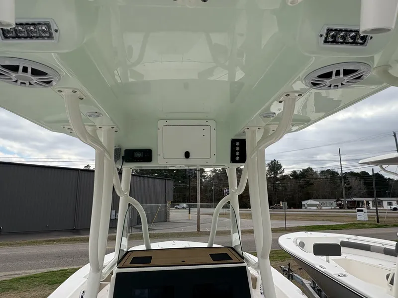 Slide: The Image of 2025 Sea Born LX LX24 boat interior with speakers and overhead console. - 14