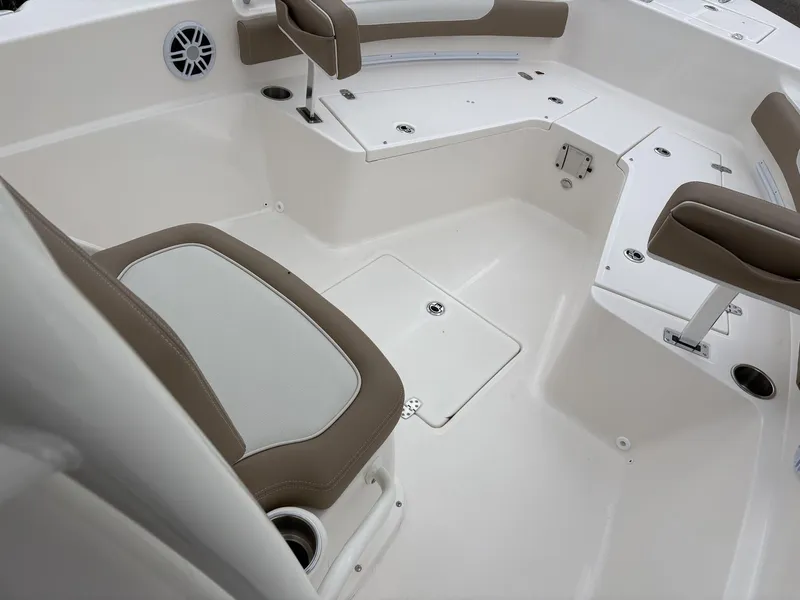 Slide: The Image of 2025 Sea Born LX LX24 boat interior with cushioned seating and storage compartments. - 19