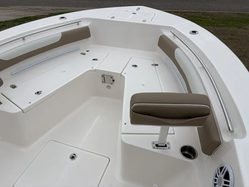 Slide: The Image of 2025 Sea Born LX LX24 boat interior with cushioned seating and storage compartments. - 20