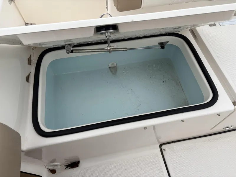 Slide: The Image of Open livewell on 2025 Sea Born LX LX24 boat, showcasing interior design. - 7