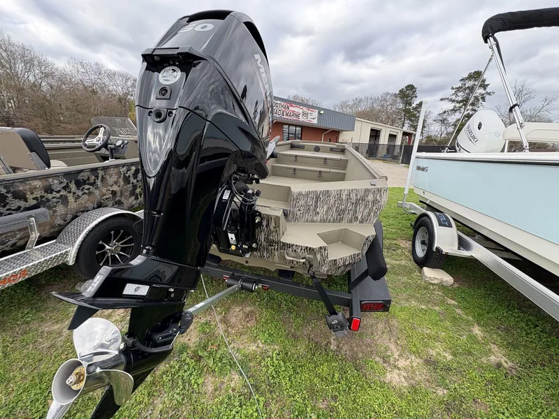 Slide: The Image of 2025 Thor Lake Hammer Hybrid 1754 boat with powerful outboard motor, displayed outdoors. - 4