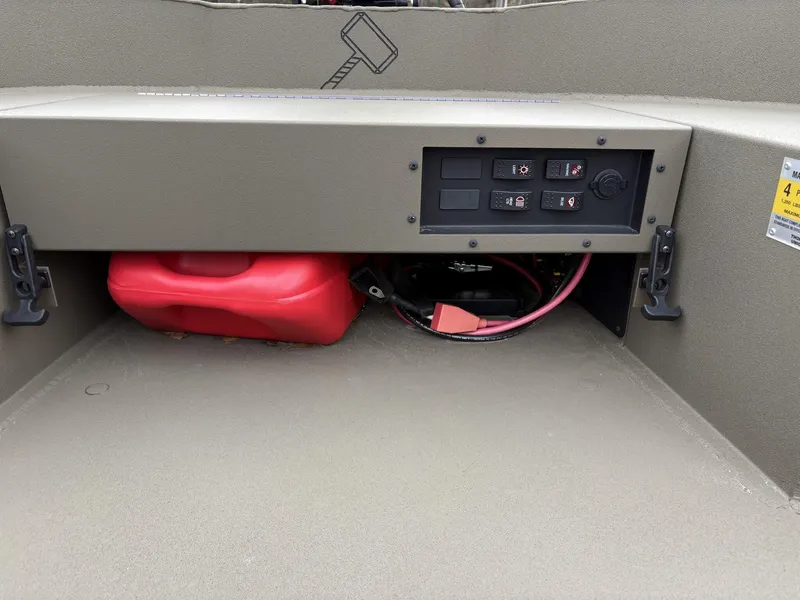 Slide: The Image of Control panel and storage area of 2025 Thor Lake Hammer Hybrid 1754 boat. - 6