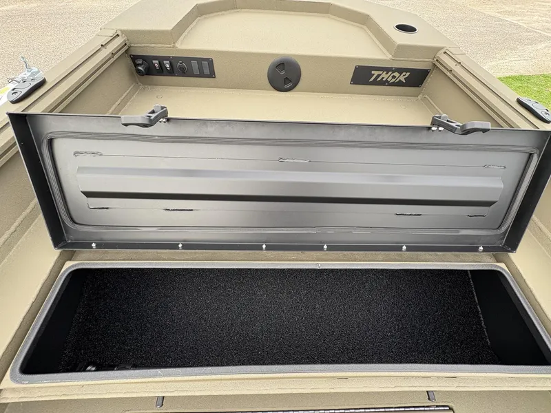 Slide: The Image of Open storage compartment in 2025 Thor Lake Hammer Hybrid 1754 boat. - 8