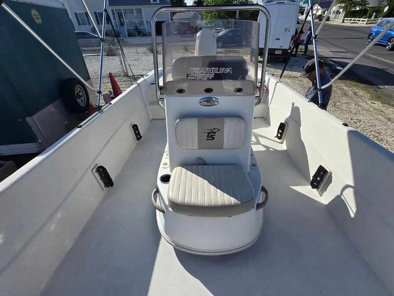 Slide: The Image of 2016 Carolina Skiff 238 DLV boat interior with center console and seating. - 12