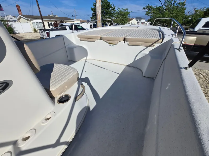 Slide: The Image of 2016 Carolina Skiff 238 DLV boat interior with seating and railings. - 7
