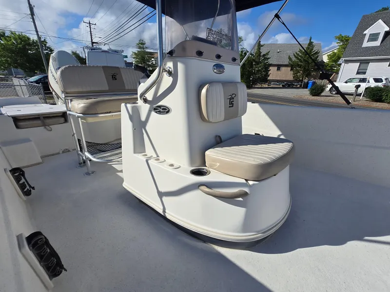 Slide: The Image of 2016 Carolina Skiff 238 DLV boat interior with seating and console. - 9