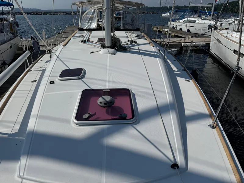 Slide: The Image of 2008 Jeanneau Sun Odyssey 42 I sailboat docked at marina, showcasing deck and hatches. - 10