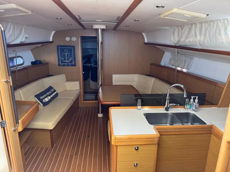 Slide: The Image of Interior of 2008 Jeanneau Sun Odyssey 42 I yacht with modern kitchen and seating area. - 13