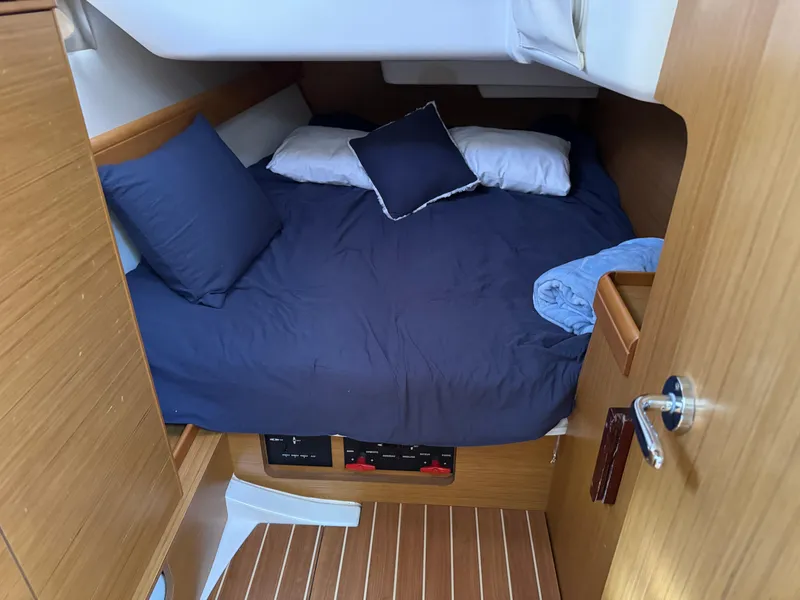Slide: The Image of Cozy cabin interior of 2008 Jeanneau Sun Odyssey 42 I sailboat with blue bedding. - 22