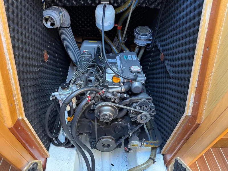 Slide: The Image of Engine compartment of 2008 Jeanneau Sun Odyssey 42 I sailboat, featuring detailed mechanical components. - 25