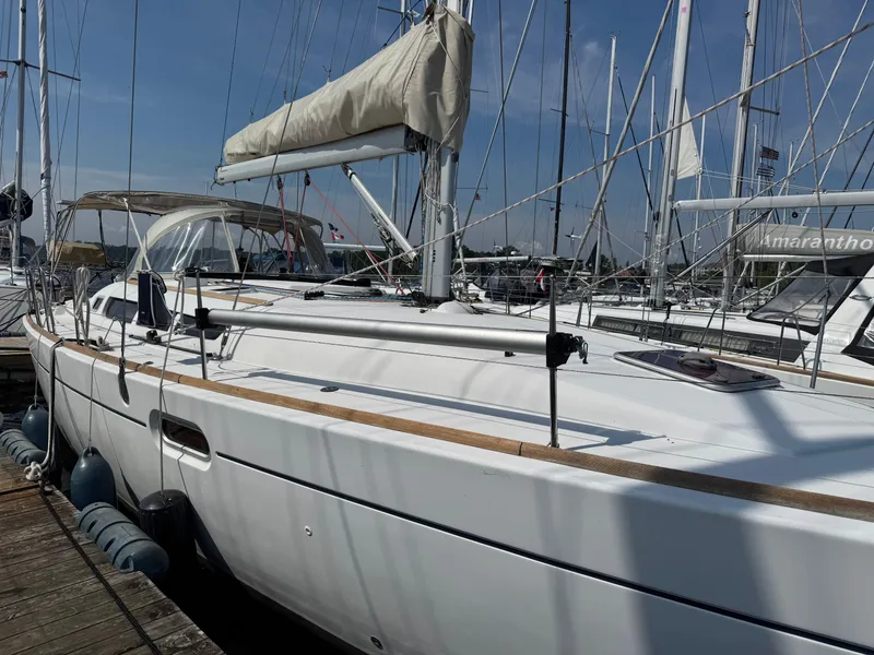 Slide: The Image of 2008 Jeanneau Sun Odyssey 42 I sailboat docked at marina, clear sky background. - 28