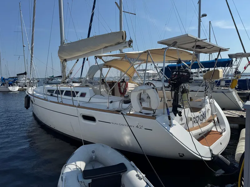 Slide: The Image of 2008 Jeanneau Sun Odyssey 42 I sailboat docked at marina, sunny day. - 2