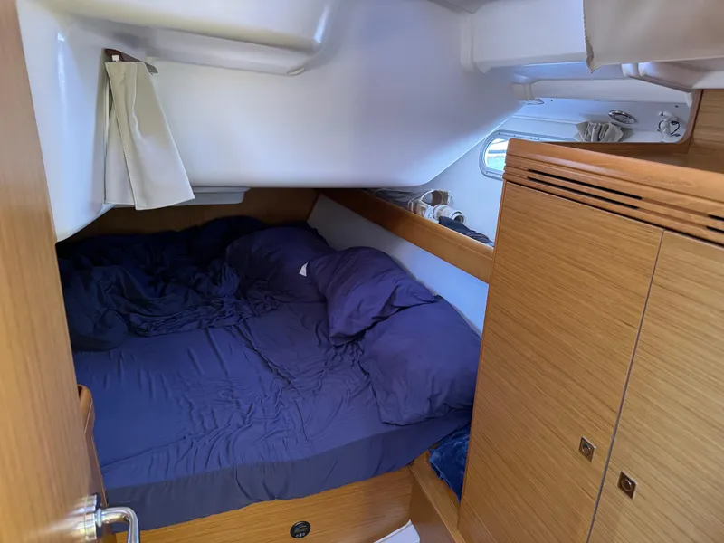 Slide: The Image of Cozy cabin interior of 2008 Jeanneau Sun Odyssey 42 I sailboat with wooden furnishings. - 23