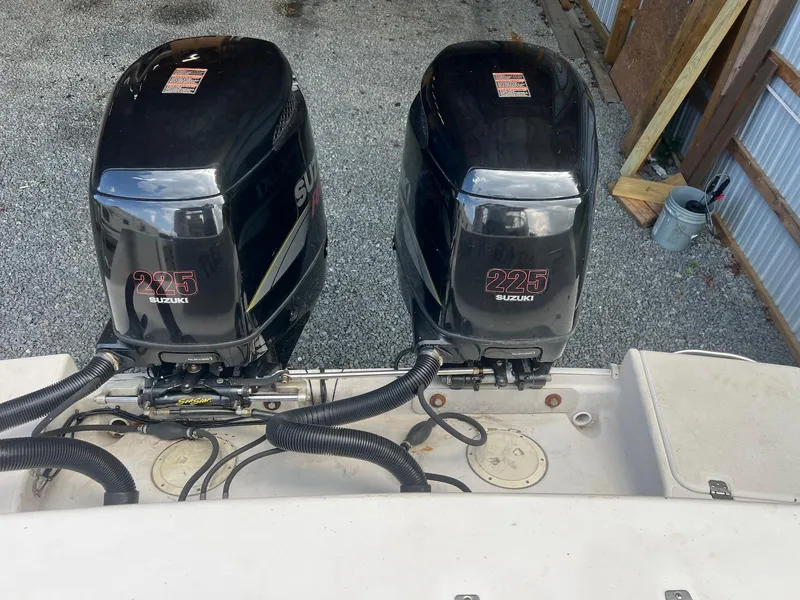 Slide: The Image of Twin Suzuki 225 outboard engines on a 1997 Pro-Line 2810 Walkaround boat. - 15