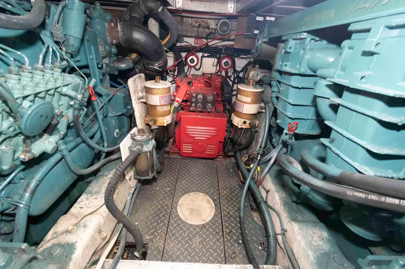 Slide: The Image of Engine room of 1989 Tiara Yachts 36 Convertible with visible machinery and components. - 15