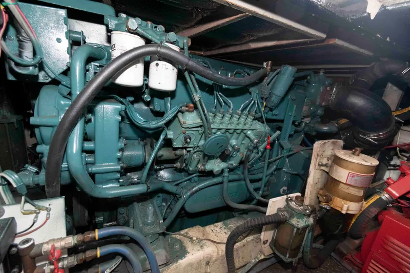Slide: The Image of Engine room of a 1989 Tiara Yachts 36 Convertible, showcasing detailed machinery. - 17