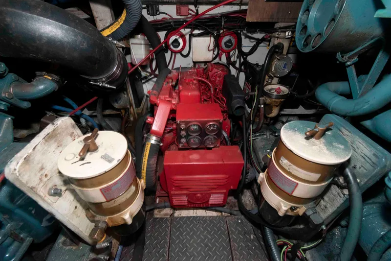 Slide: The Image of Engine room of 1989 Tiara Yachts 36 Convertible with visible components and wiring. - 18