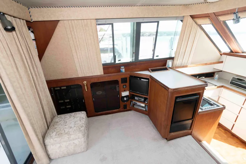Slide: The Image of Interior of 1989 Tiara Yachts 36 Convertible with kitchen and entertainment area. - 9
