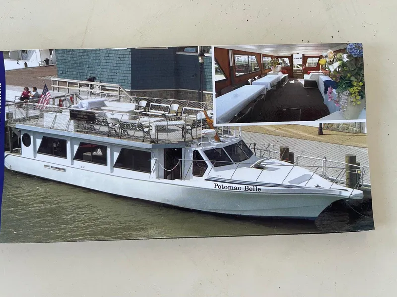 The Image of 1990 Bluewater Yachts passenger vessel "Potomac Belle" docked, with interior dining area view. - 1
