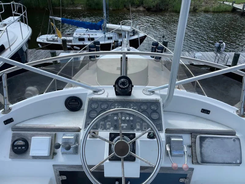 Slide: The Image of Cockpit view of 1986 Shannon Brendan 32 boat with steering wheel and control panel. - 4