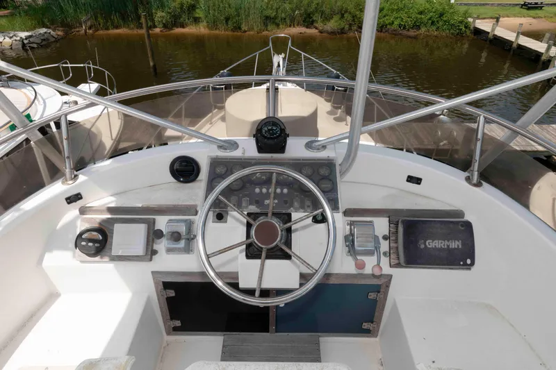 Slide: The Image of Cockpit of 1986 Shannon Brendan 32 boat with steering wheel and navigation instruments. - 8