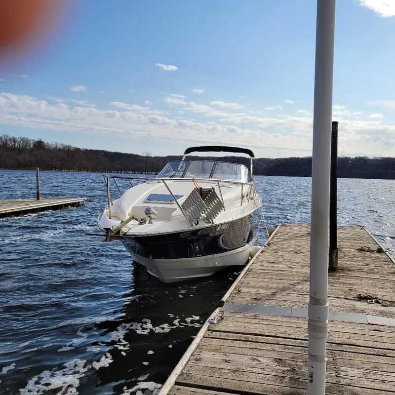Slide: The Image of 2005 Chaparral 270 Signature boat docked on a sunny day. - 1