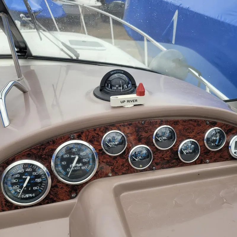 Slide: The Image of Dashboard of a 2005 Chaparral 270 Signature boat with gauges and compass. - 7