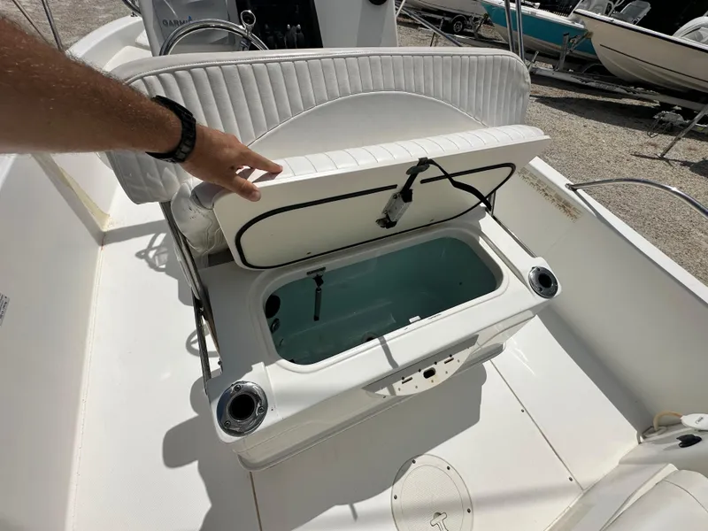 Slide: The Image of Open storage compartment on a 2010 Boston Whaler 200 Dauntless boat. - 13