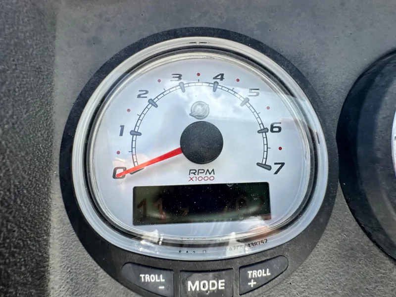 Slide: The Image of Tachometer of 2010 Boston Whaler 200 Dauntless showing RPM with troll mode buttons. - 15