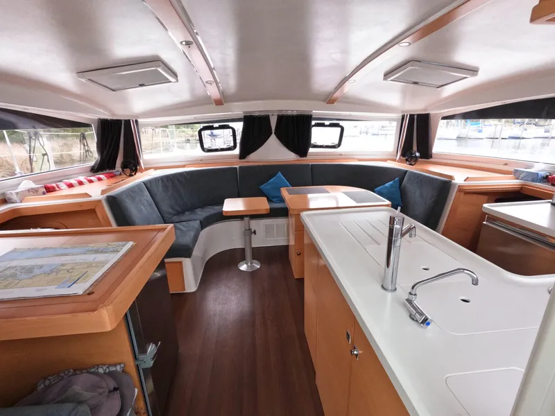 Slide: The Image of Spacious interior of 2013 Nautitech 442 catamaran with modern kitchen and seating area. - 12