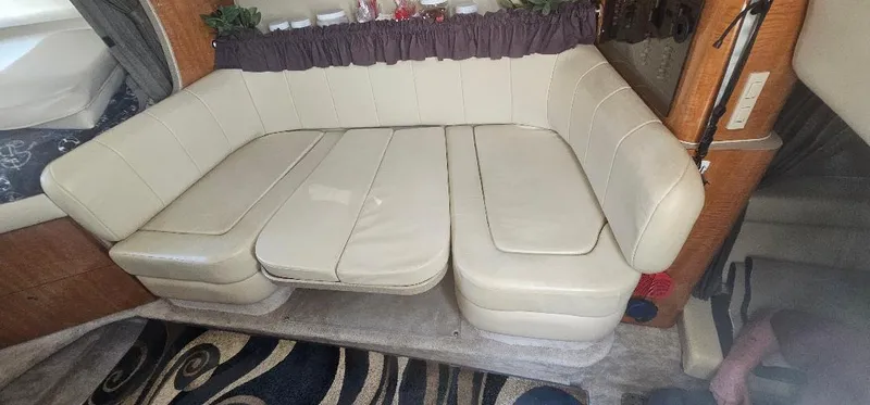 Slide: The Image of 2002 Regal Commodore 3060 interior with beige leather seating and decorative elements. - 10