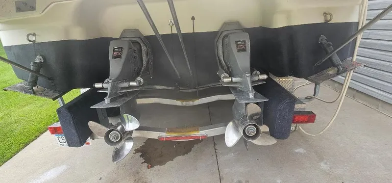 Slide: The Image of Rear view of a 2002 Regal Commodore 3060 boat with dual propellers. - 12