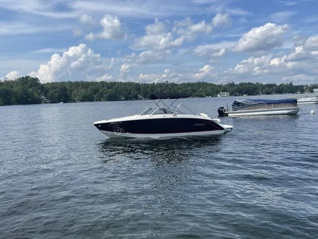 Slide: The Image of 2019 Cobalt R5 boat on a lake under a partly cloudy sky. - 10