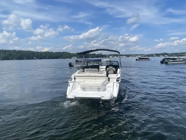 Slide: The Image of 2019 Cobalt R5 boat cruising on a lake under a partly cloudy sky. - 14
