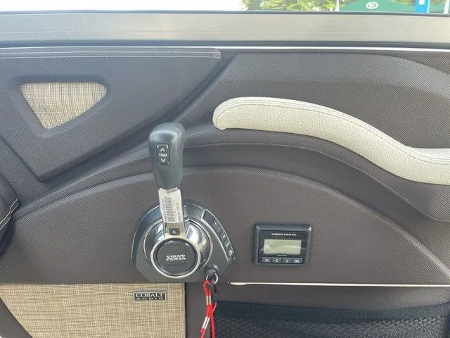 Slide: The Image of Interior of a 2019 Cobalt R5 boat, featuring control panel and throttle lever. - 19