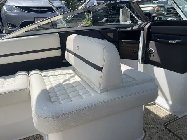 Slide: The Image of Interior of a 2019 Cobalt R5 boat with white leather seating. - 25