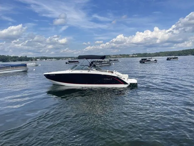 Slide: The Image of 2019 Cobalt R5 boat on a lake under a partly cloudy sky. - 3