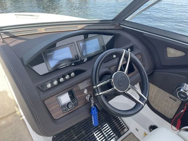 Slide: The Image of 2019 Cobalt R5 boat dashboard with steering wheel and digital displays. - 31