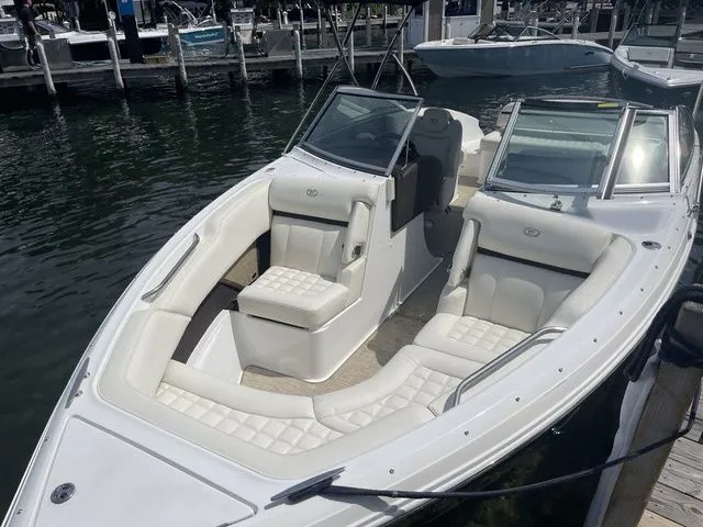 Slide: The Image of 2019 Cobalt R5 boat with white seating, docked at marina. - 37