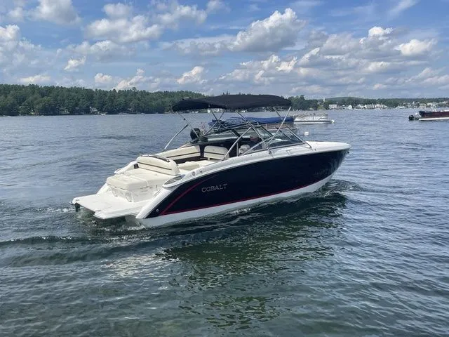 Slide: The Image of 2019 Cobalt R5 boat cruising on a lake under a partly cloudy sky. - 4