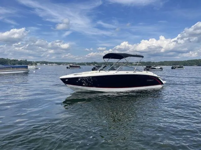 Slide: The Image of 2019 Cobalt R5 boat on a lake under a blue sky with clouds. - 5
