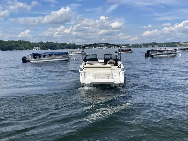 Slide: The Image of 2019 Cobalt R5 boat cruising on a lake under a partly cloudy sky. - 7