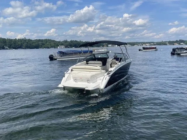 Slide: The Image of 2019 Cobalt R5 boat cruising on a lake under a partly cloudy sky. - 8