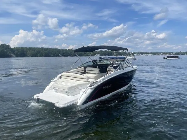 Slide: The Image of 2019 Cobalt R5 boat cruising on a lake under a partly cloudy sky. - 9