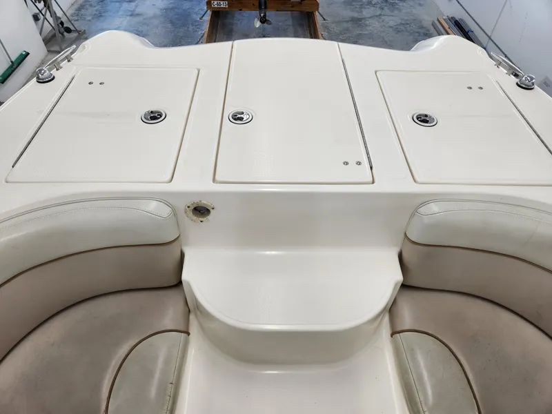 Slide: The Image of 2000 World Cat 266 Leisure Cat boat interior with seating and storage compartments. - 11