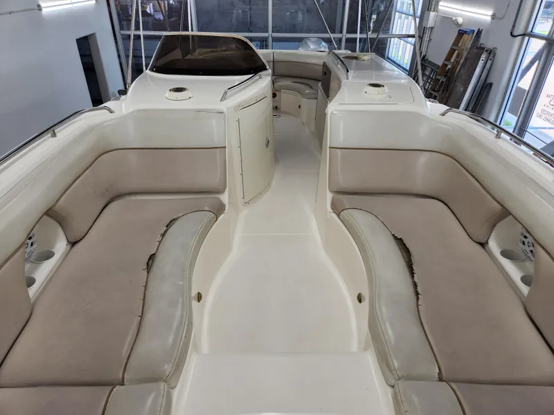 Slide: The Image of 2000 World Cat 266 Leisure Cat interior with beige seating and spacious layout. - 12