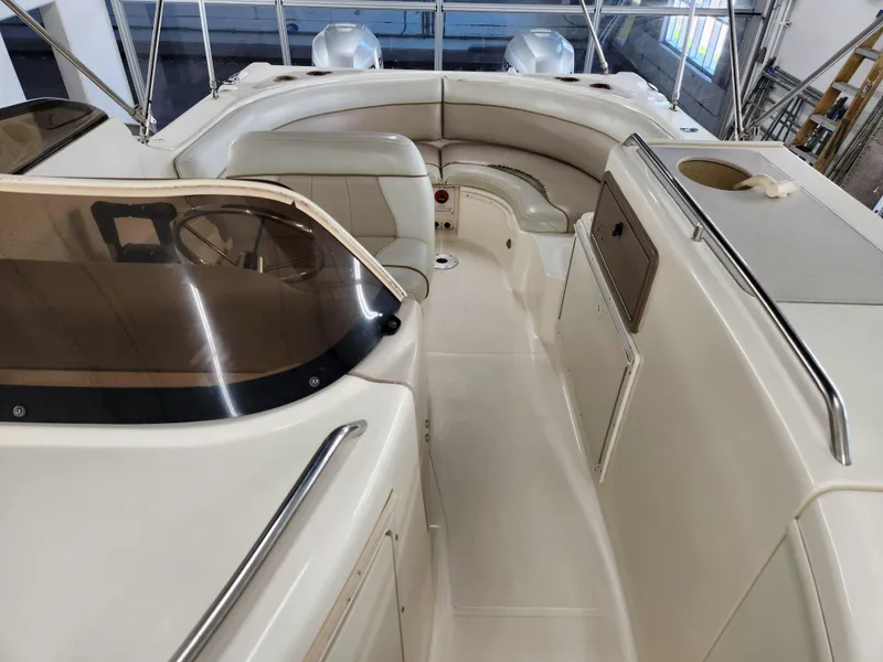 Slide: The Image of 2000 World Cat 266 Leisure Cat interior with seating and helm, showcasing spacious design. - 13